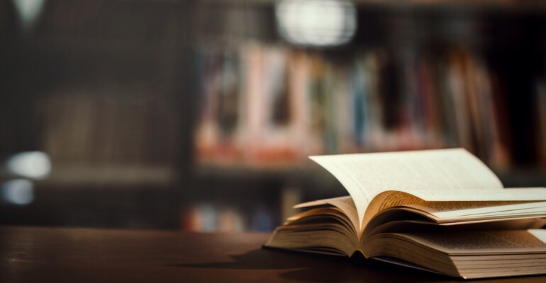 Book in library with open textbook,education learning concept