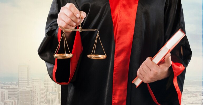 Close-up  judge with scale at courtroom