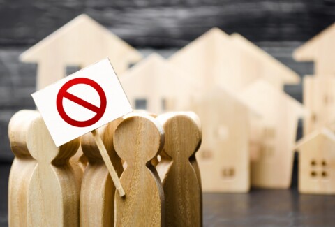 A group of people with posters demonstrate protest. The struggle for rights and freedom, rejection of anti-peoples laws and reforms. An angry mob. Political movement. Social discontent, tension.