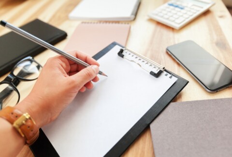 Hands of business woman signing the contract document