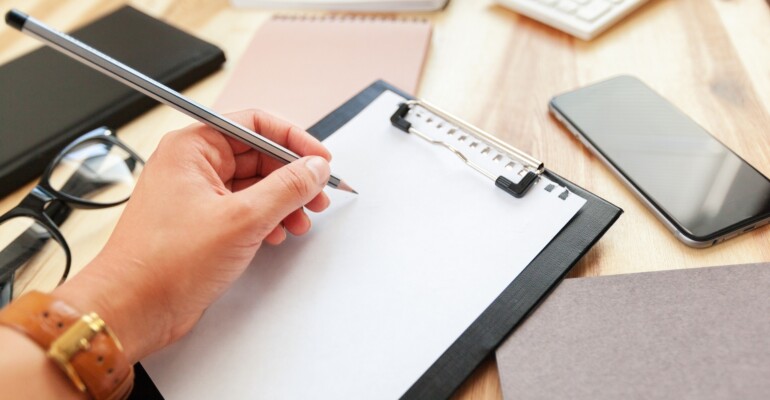 Hands of business woman signing the contract document