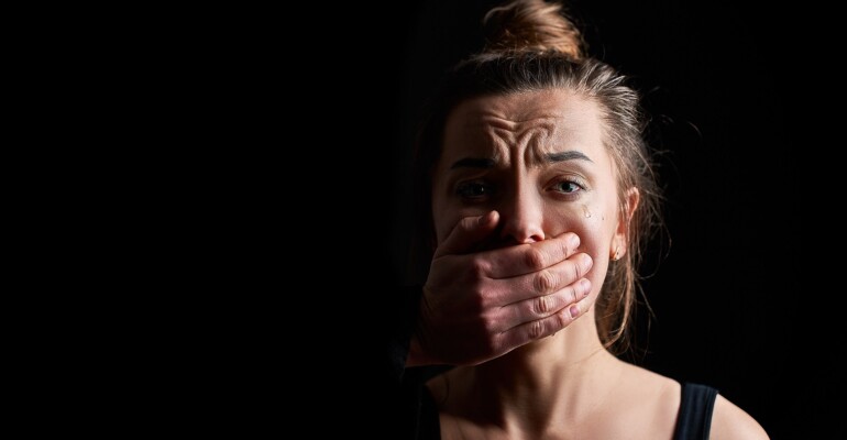 Stressed unhappy crying woman victim in fear suffering from fema